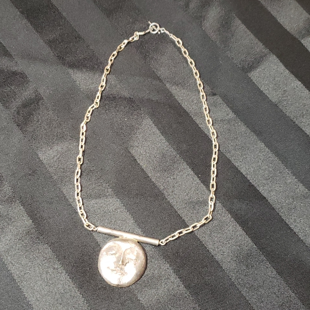 Unique face necklace. Purchased at a Festival